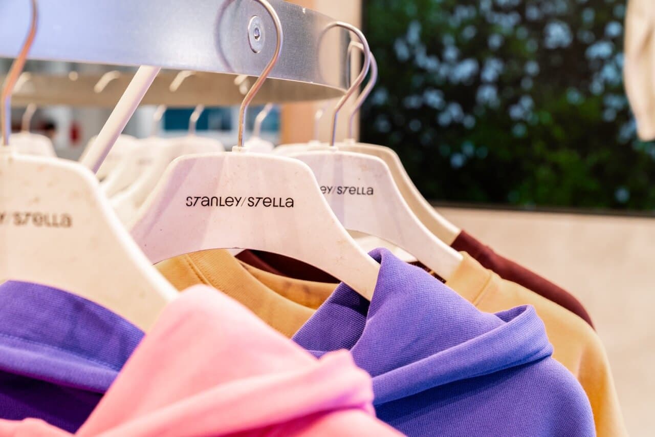 Stanley Stella garments on hangers